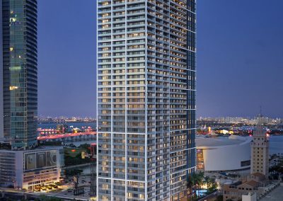 3D rendering sample of the building design for Natiivo Miami condo at night.